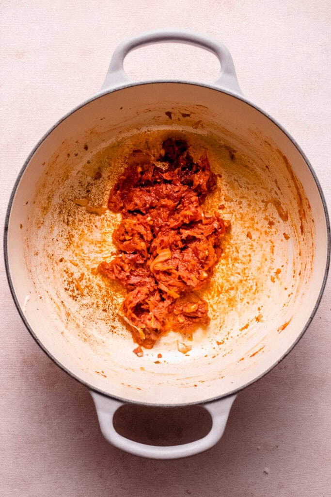 Tomato paste added to pot.