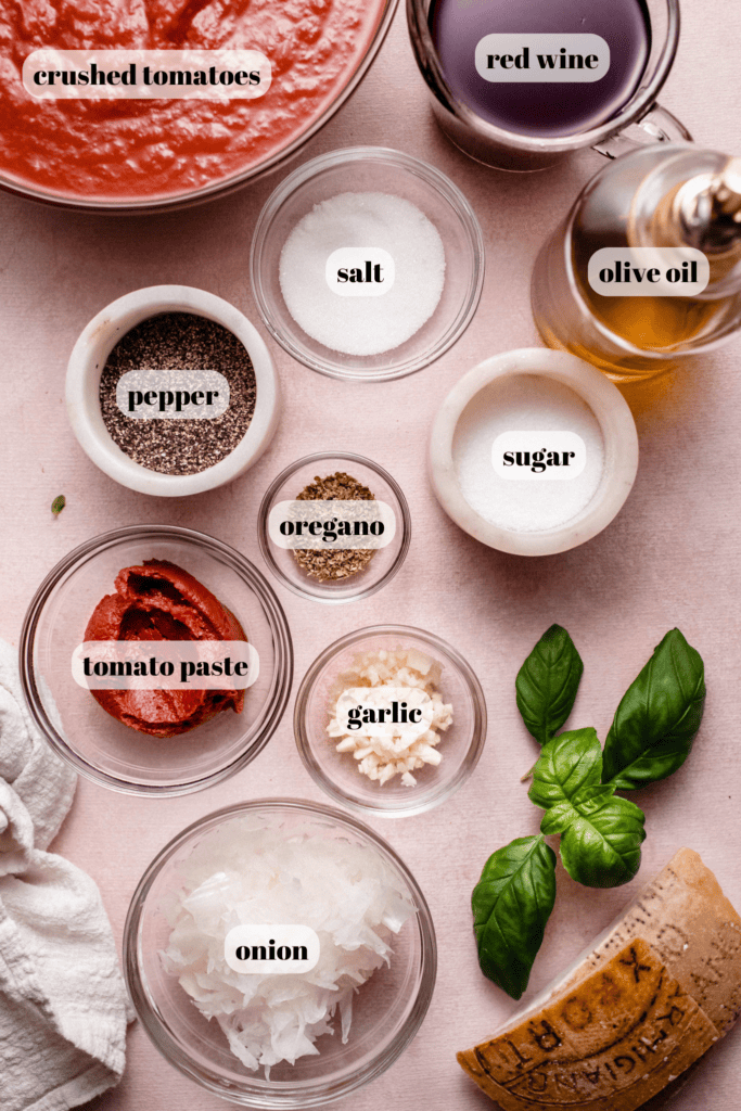 Ingredients for red wine pasta sauce labeled on counter.