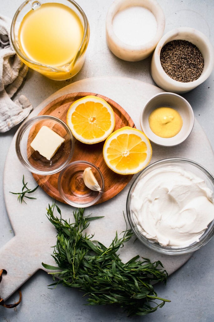 Ingredients for tarragon cream sauce on counter.