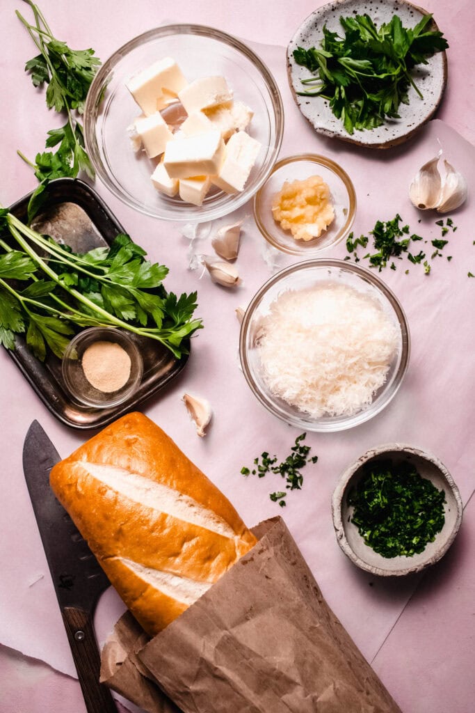 Ingredients for garlic bread on counter.