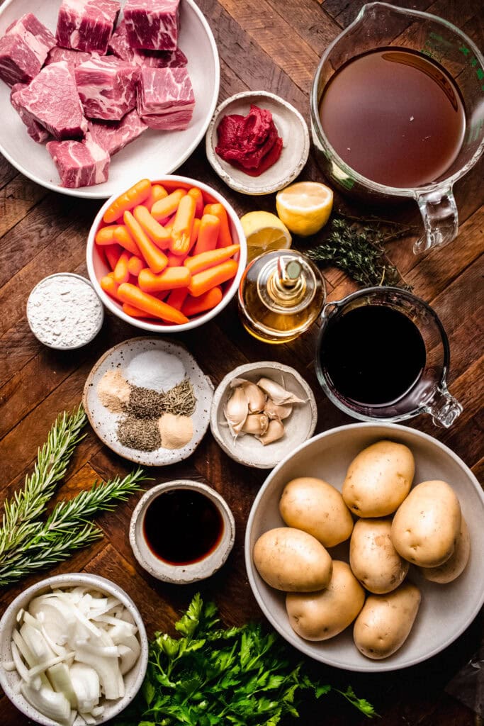 Ingredients for beef stew on counter.
