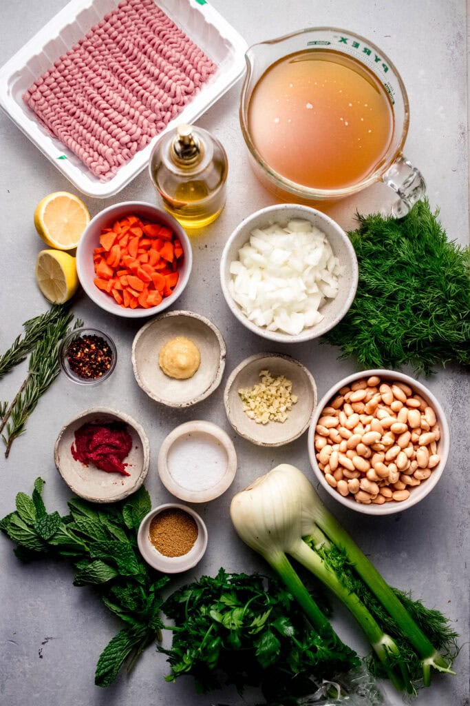 Ingredients for lemony turkey bean soup on counter.