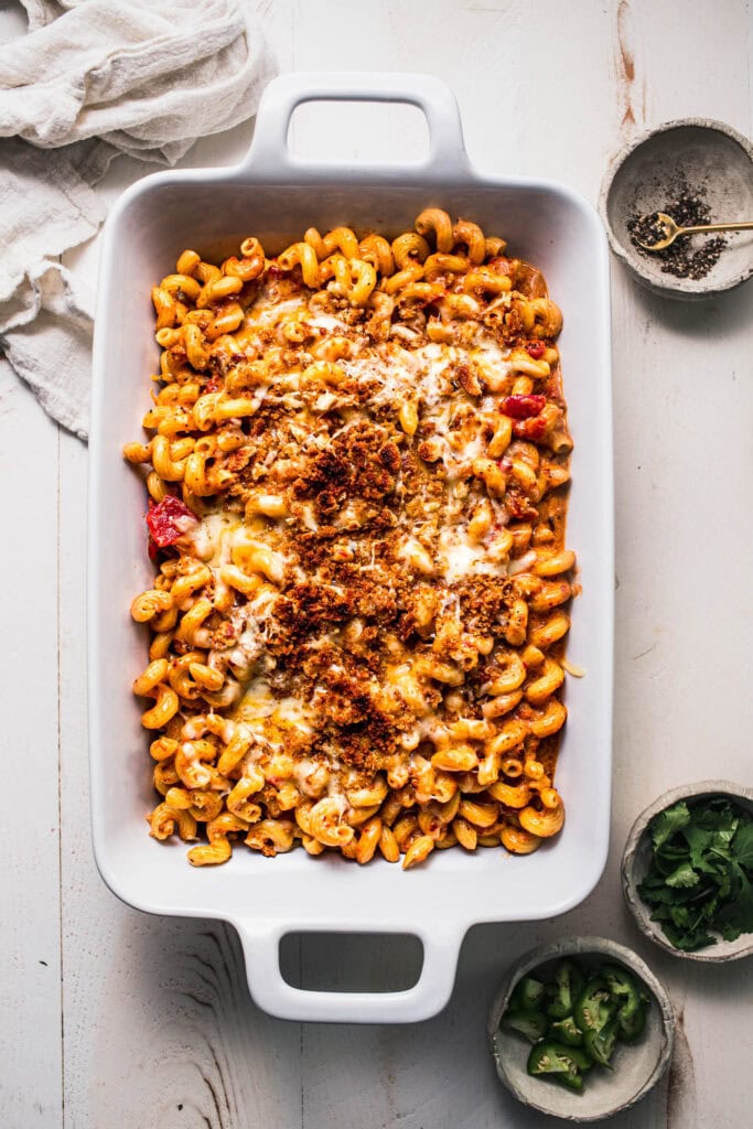 Chorizo mac and cheese in baking dish before sprinkling with toppings.