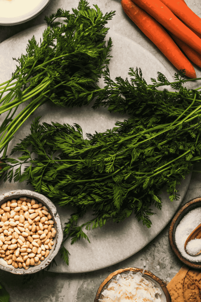 Carrot tops on counter.