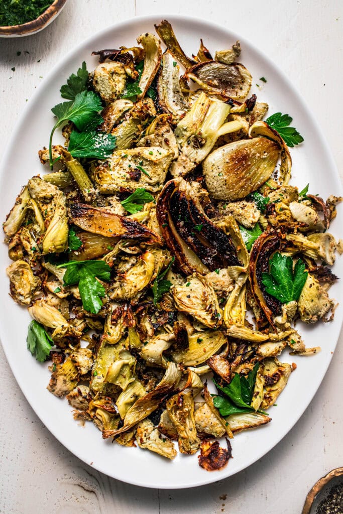 Serving platter with roasted fennel and artichoke hearts ready to eat.