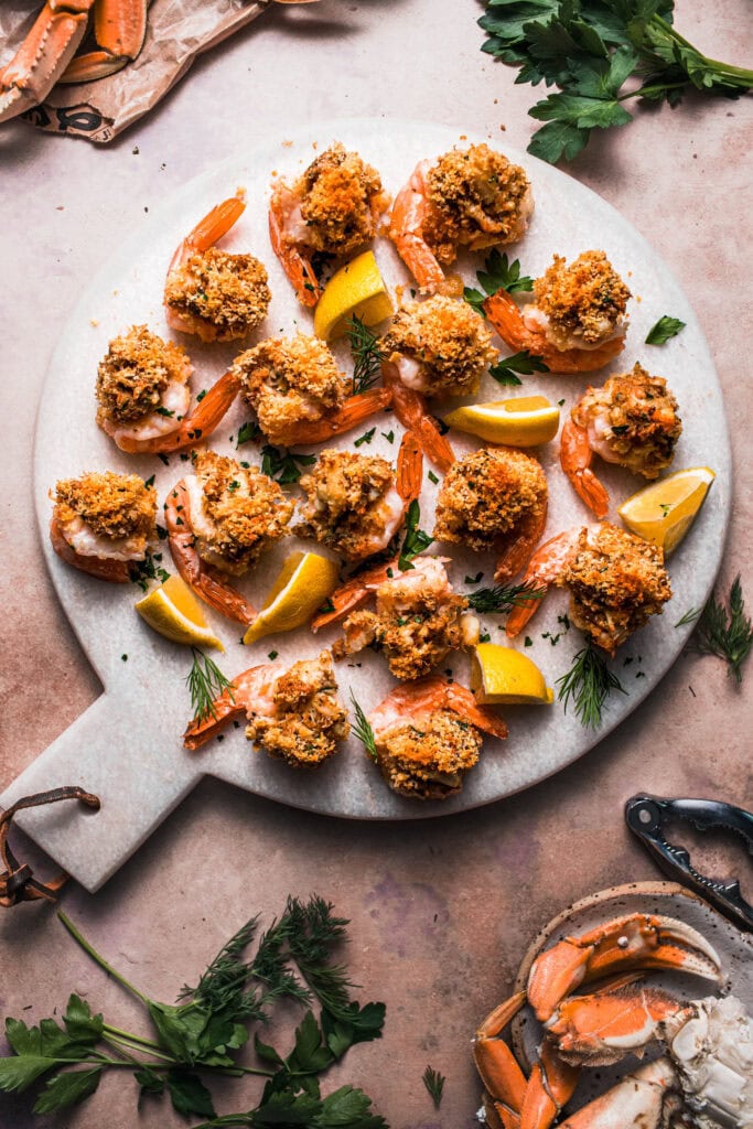 Crab stuffed shrimp arranged on serving platter.