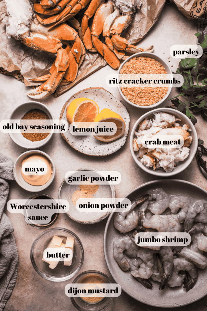 Ingredients for crab stuffed shrimp labeled on counter.