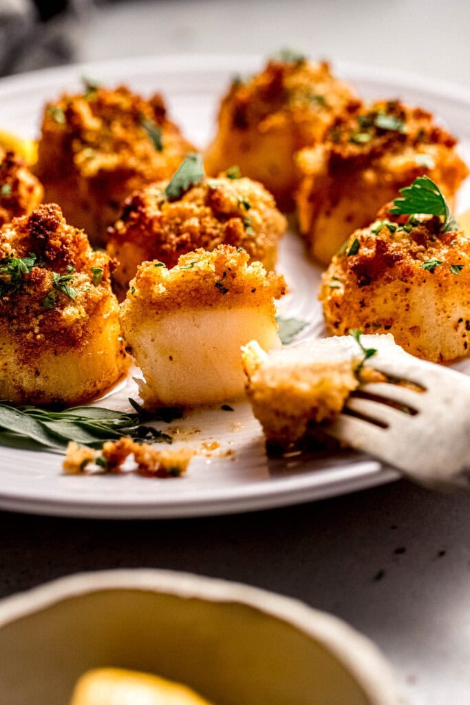 Side view of Air fryer scallop sliced into exposing tender white center.