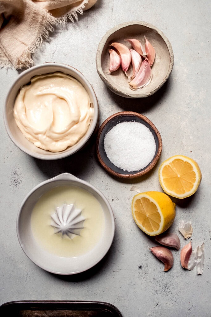 Ingredients for garlic aioli on counter.