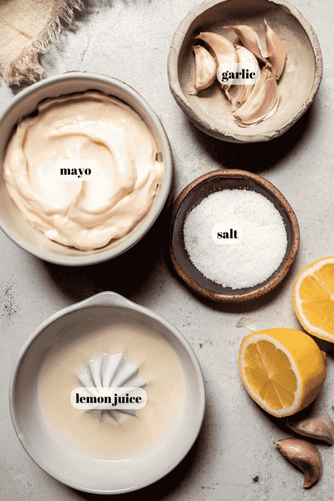 Ingredients for cheater garlic aioli labeled on counter.