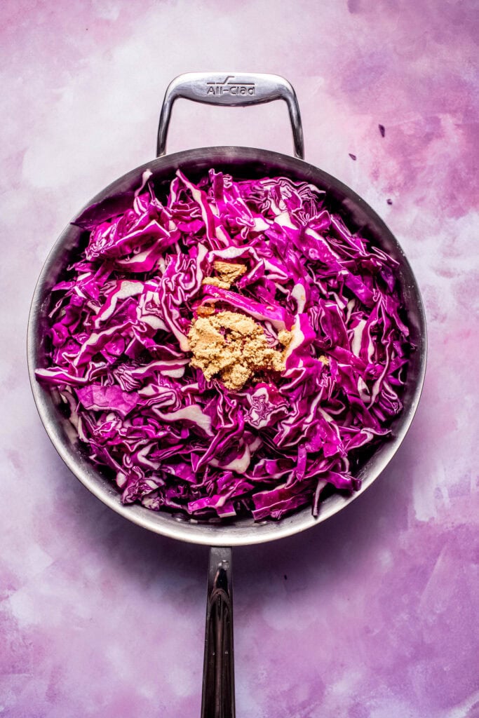 Brown sugar and cabbage added to skillet.
