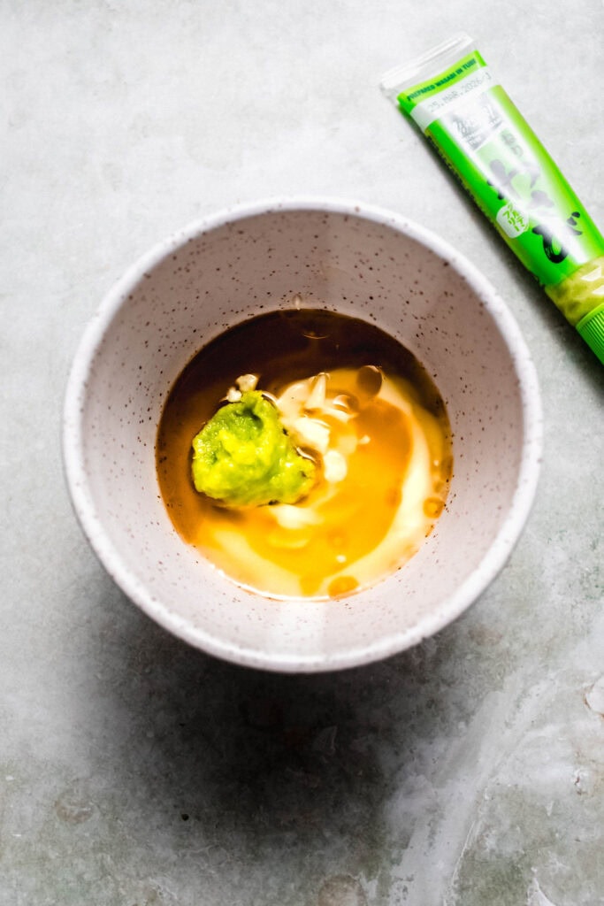Ingredients for wasabi mayo added to bowl before stirring.