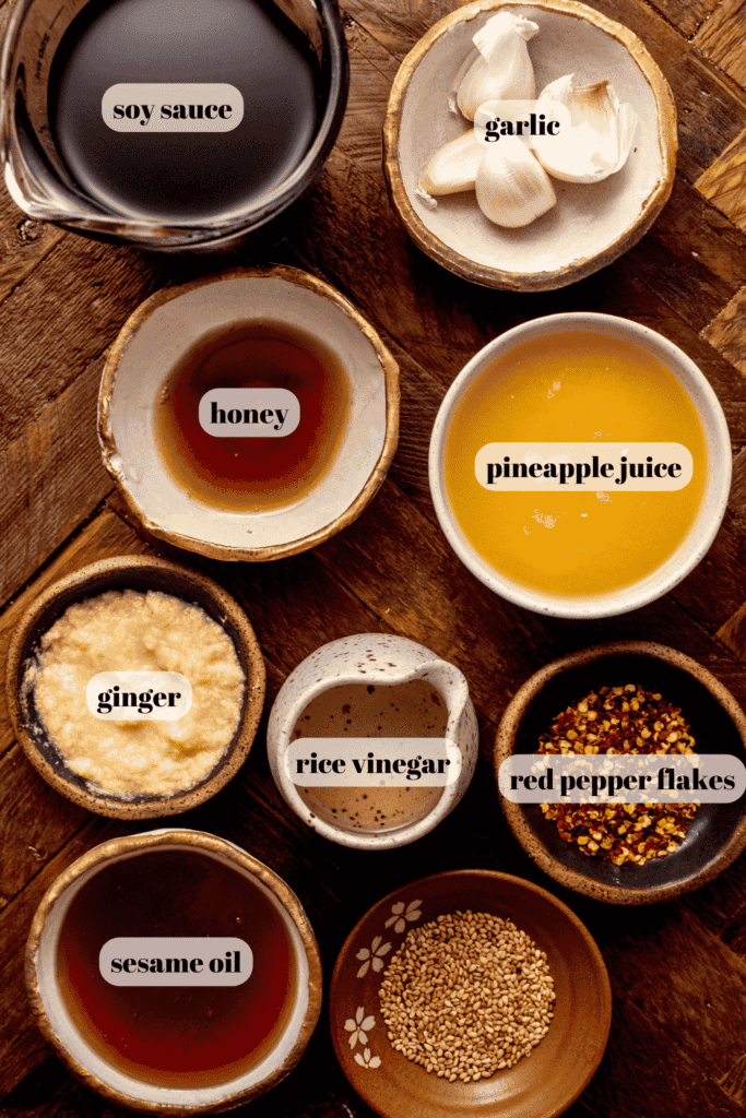 Ingredients for asian flank steak marinade labeled on counter.