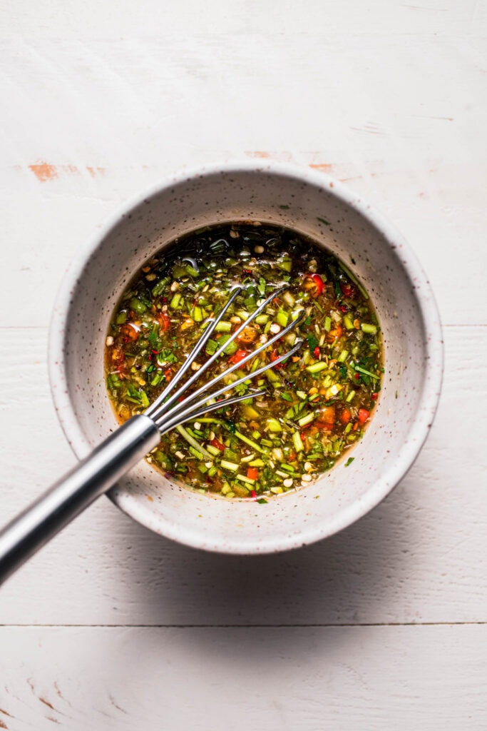 Crying tiger sauce whisked together in bowl.