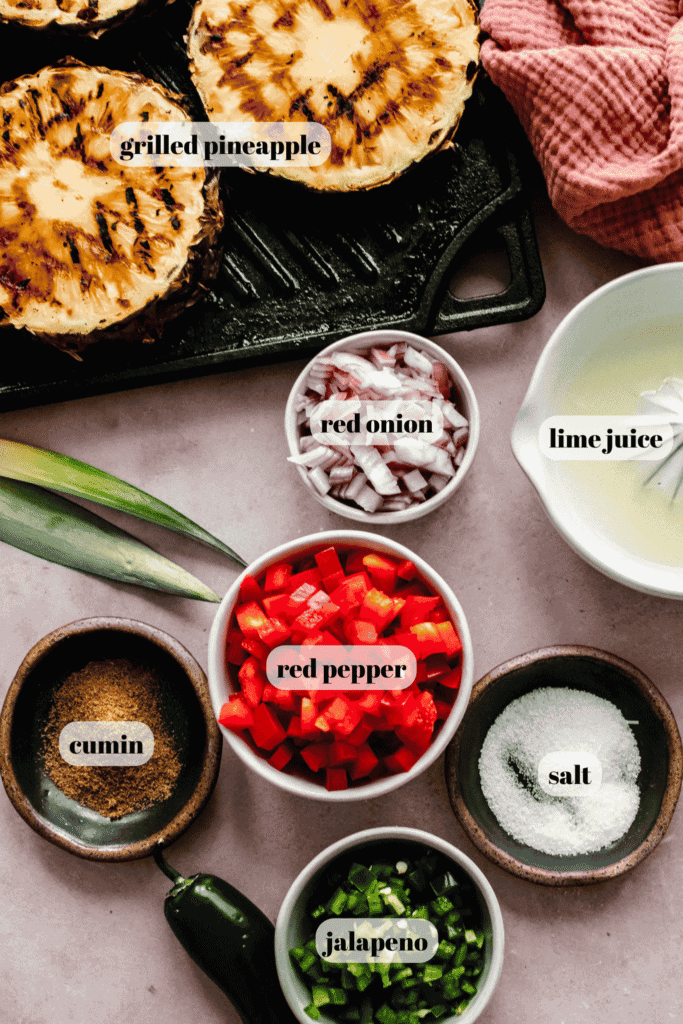 Ingredients for grilled pineapple salsa labeled on counter.
