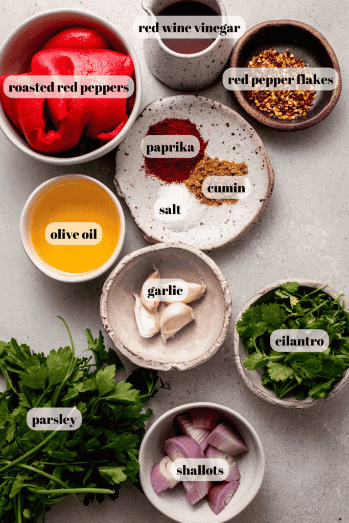 Ingredients for red chimichurri sauce labeled on counter.