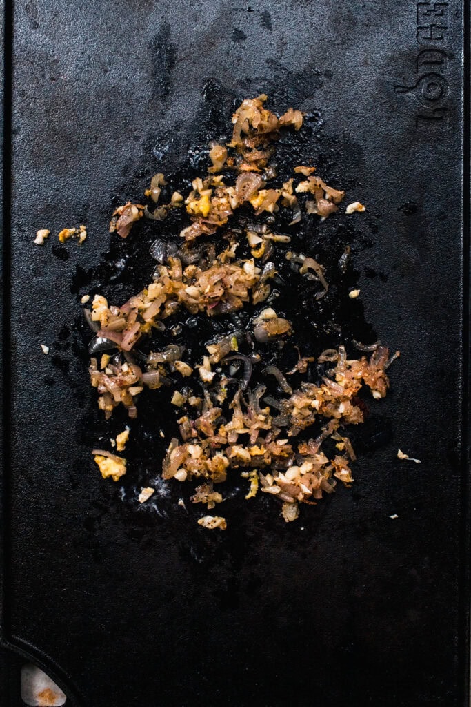 Shallot cooking on griddle.