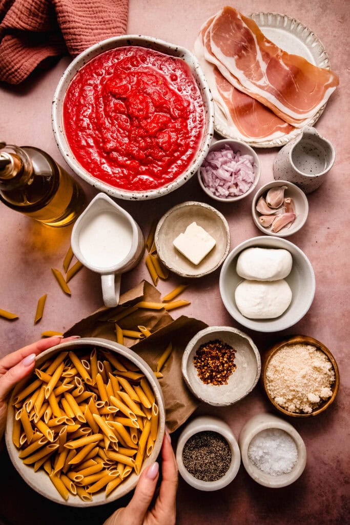 Ingredients for spicy vodka rigatoni on counter.