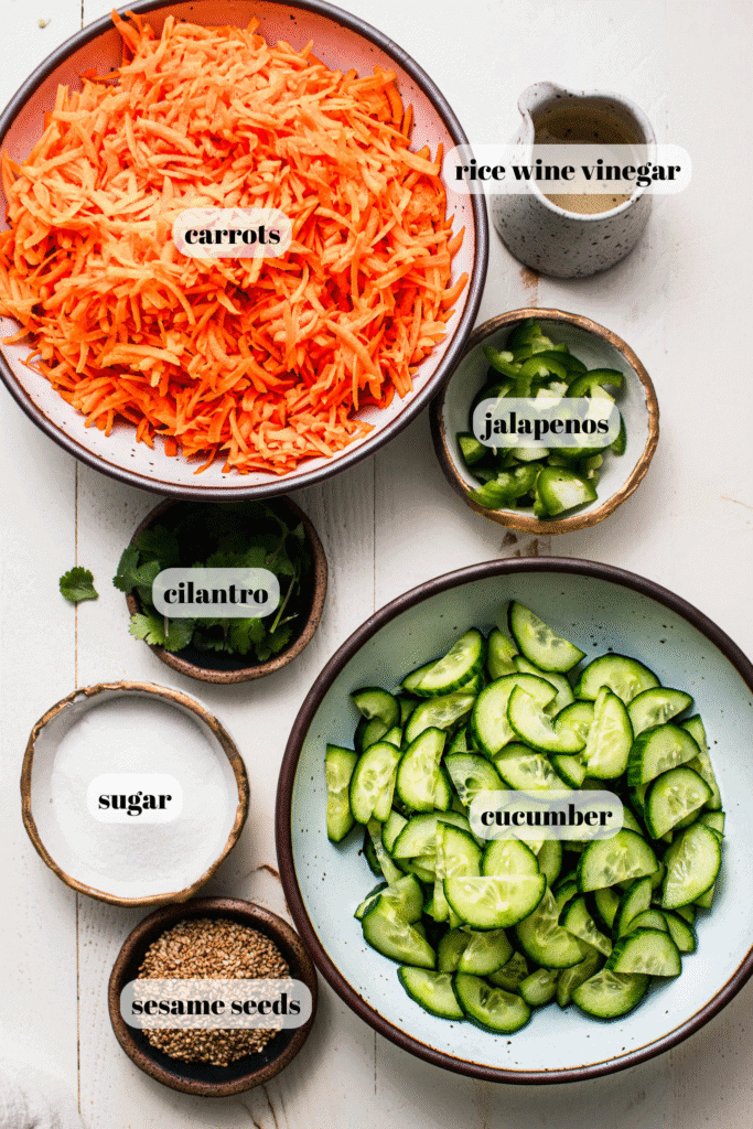 Ingredients for carrot cucumber salad on counter.