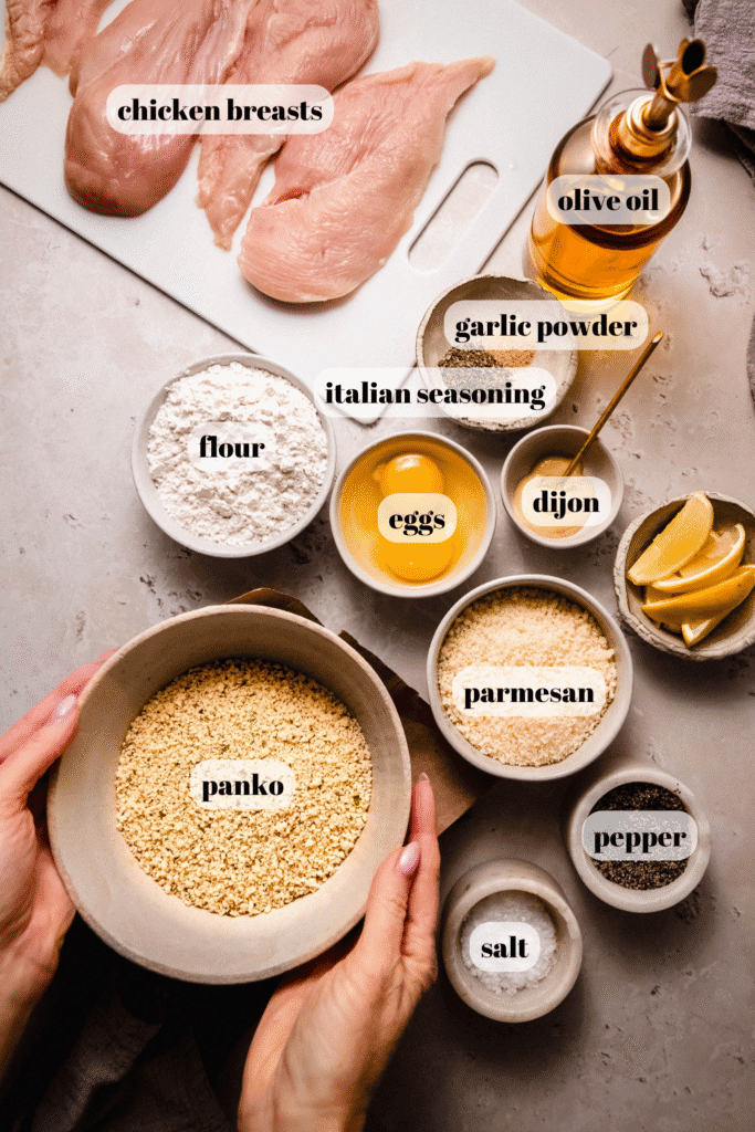 Ingredients for parmesan chicken cutlets on counter.