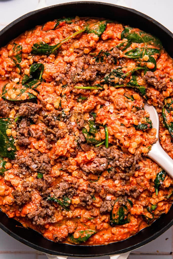 Overhead close up of finished pastina alla vodka in skillet.