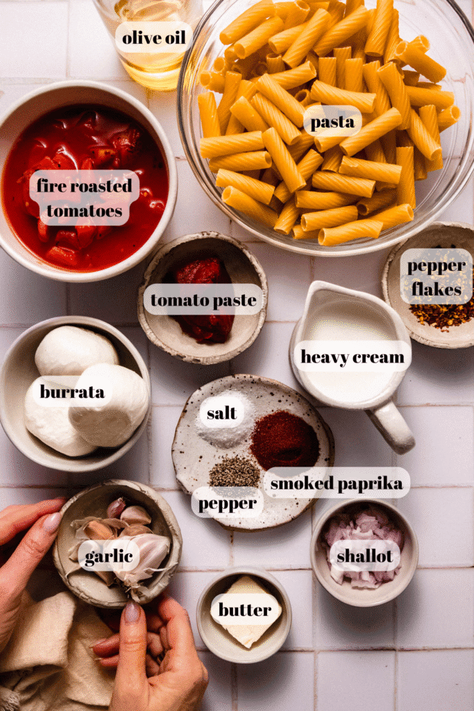 Ingredients for smoky tomato pasta labeled on counter.