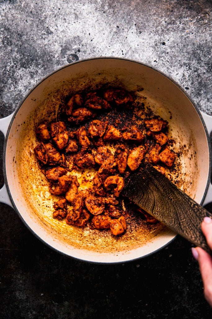 Chicken browning in pot.