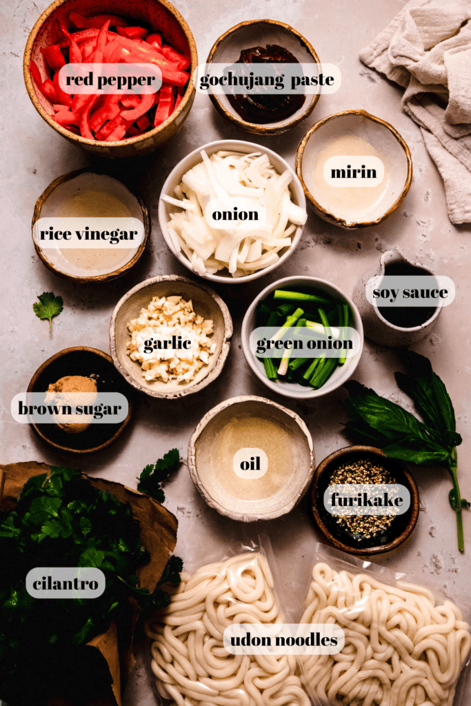 Ingredients for gochujang noodles labeled on counter.