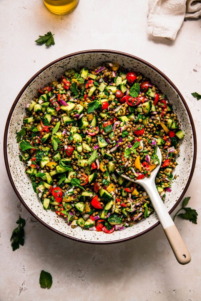 Finished lentil tabouli salad in large serving bowl.