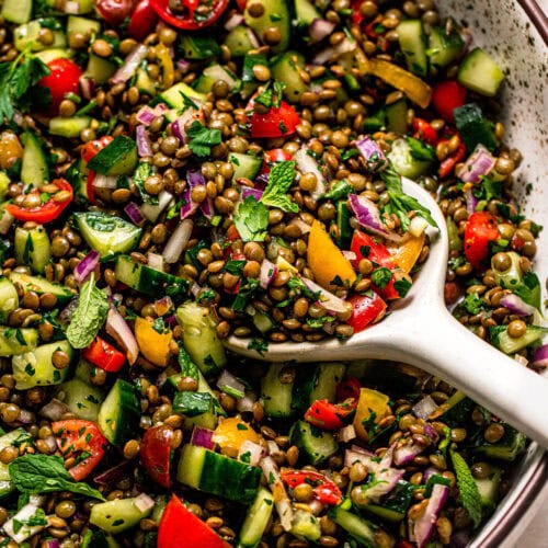 Overhead close up of lentil tabbouleh salad with serving spoon.