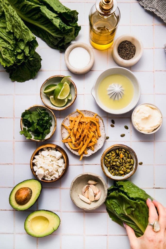 Ingredients for Mexican caesar salad on counter.