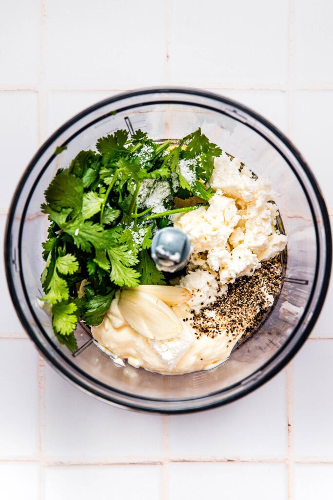 Ingredients for mexican caesar salad dressing in food processor before blending.