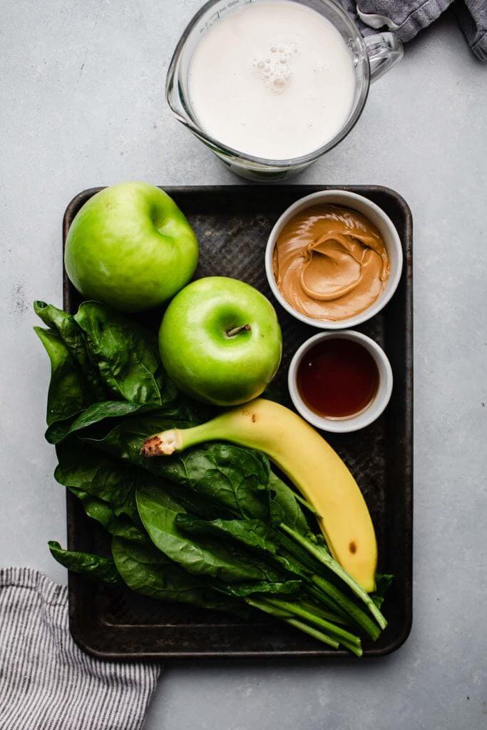 Ingredients for green smoothie on tray. 