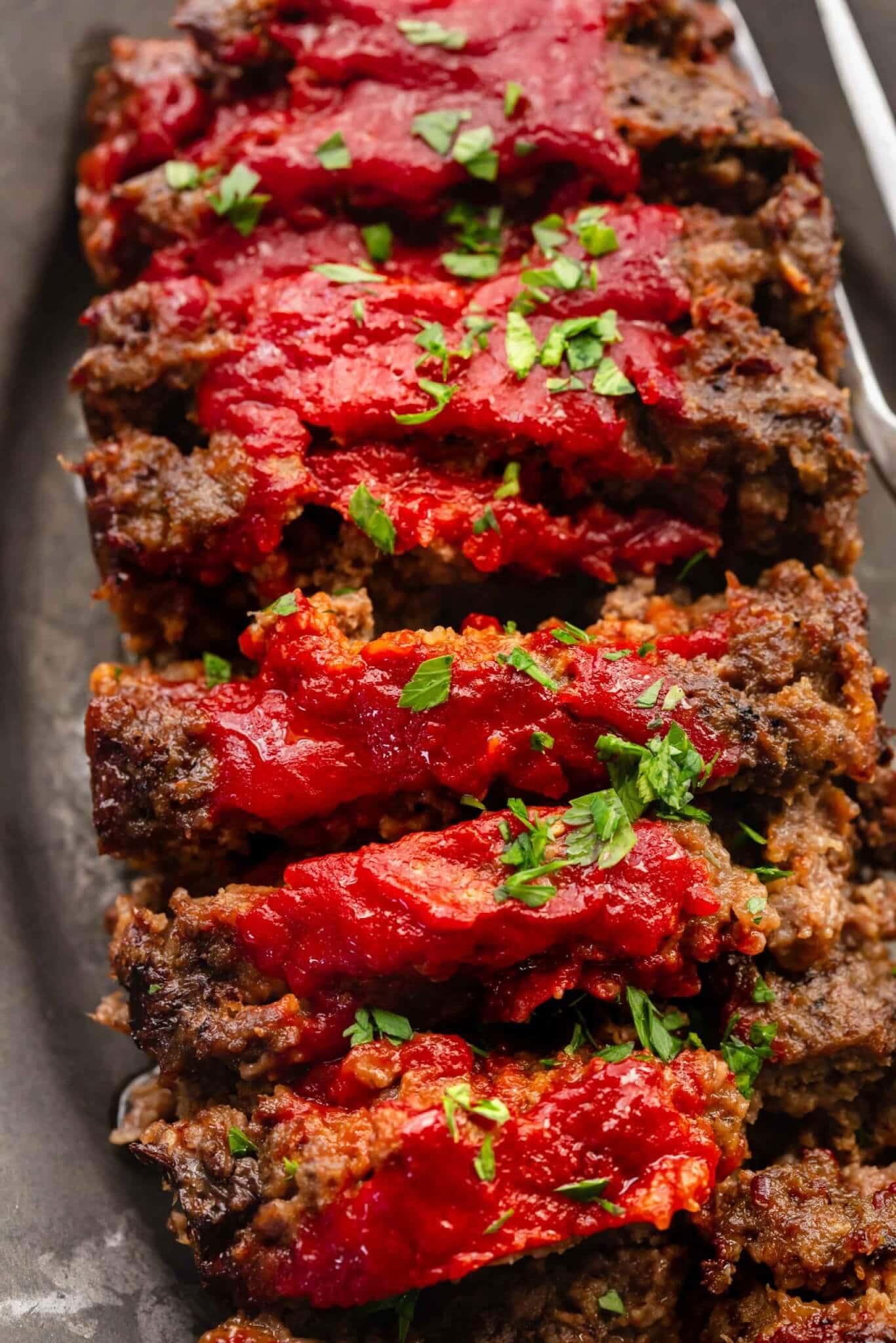 Sliced BOSTON MARKET meatloaf on serving platter.