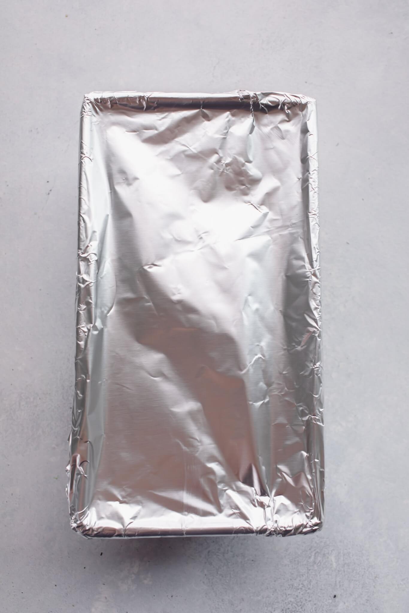 Pan of meatloaf covered with foil.