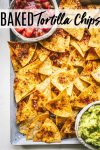 Homemade Baked Tortilla Chips are made using store-bought corn tortillas. Just cut them into wedges, season them with Mexican spices, spray with oil & bake for a perfectly crispy, dippable chip! #healthychips #tortillachips #healthysnack #bakedtortillachips #lowfatchips