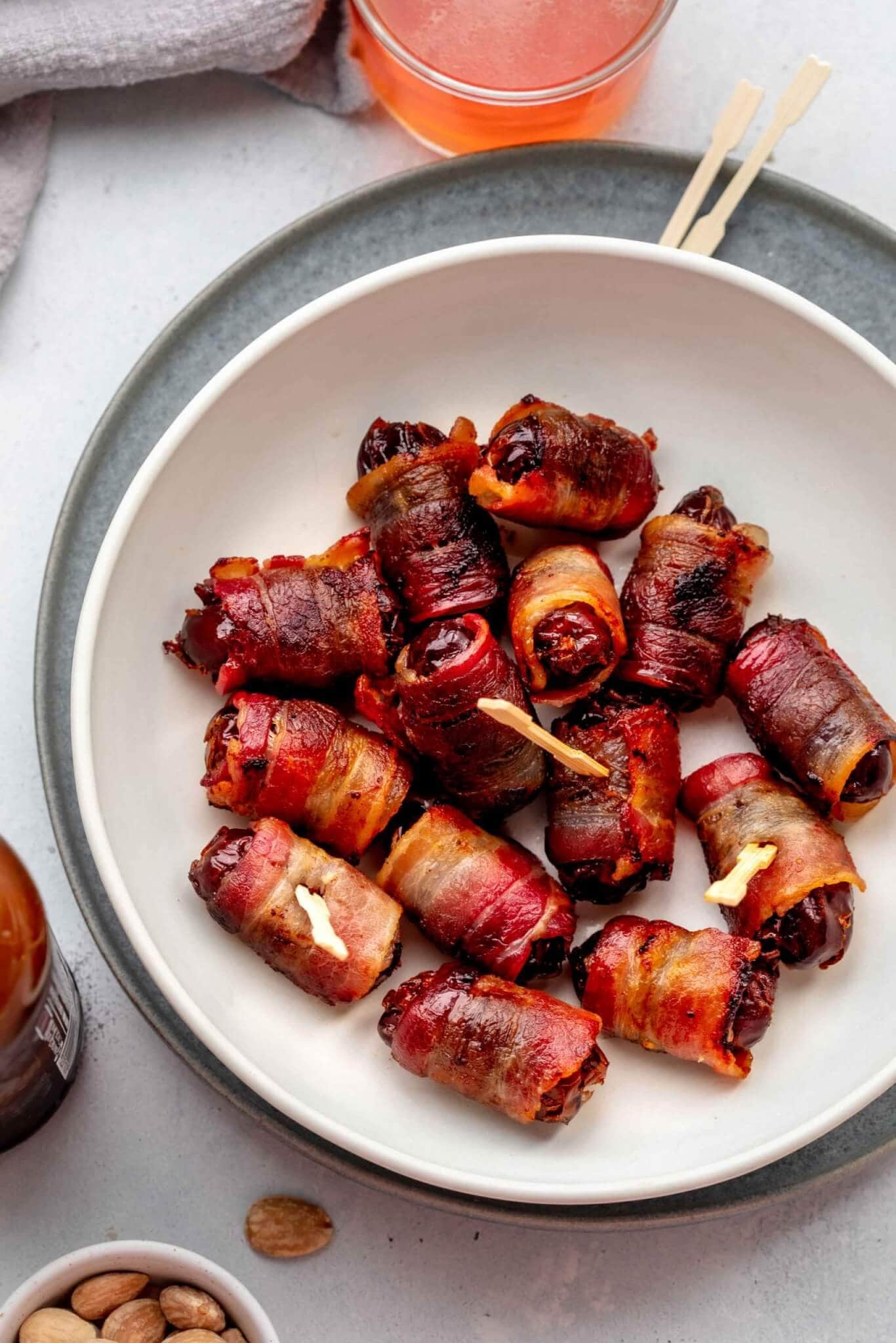 Overhead shot of bacon wrapped dates in bowl. 