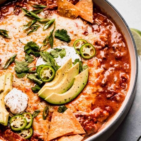 SIDE VIEW OF ENCHILADA DIP IN LARGE SKILLET.