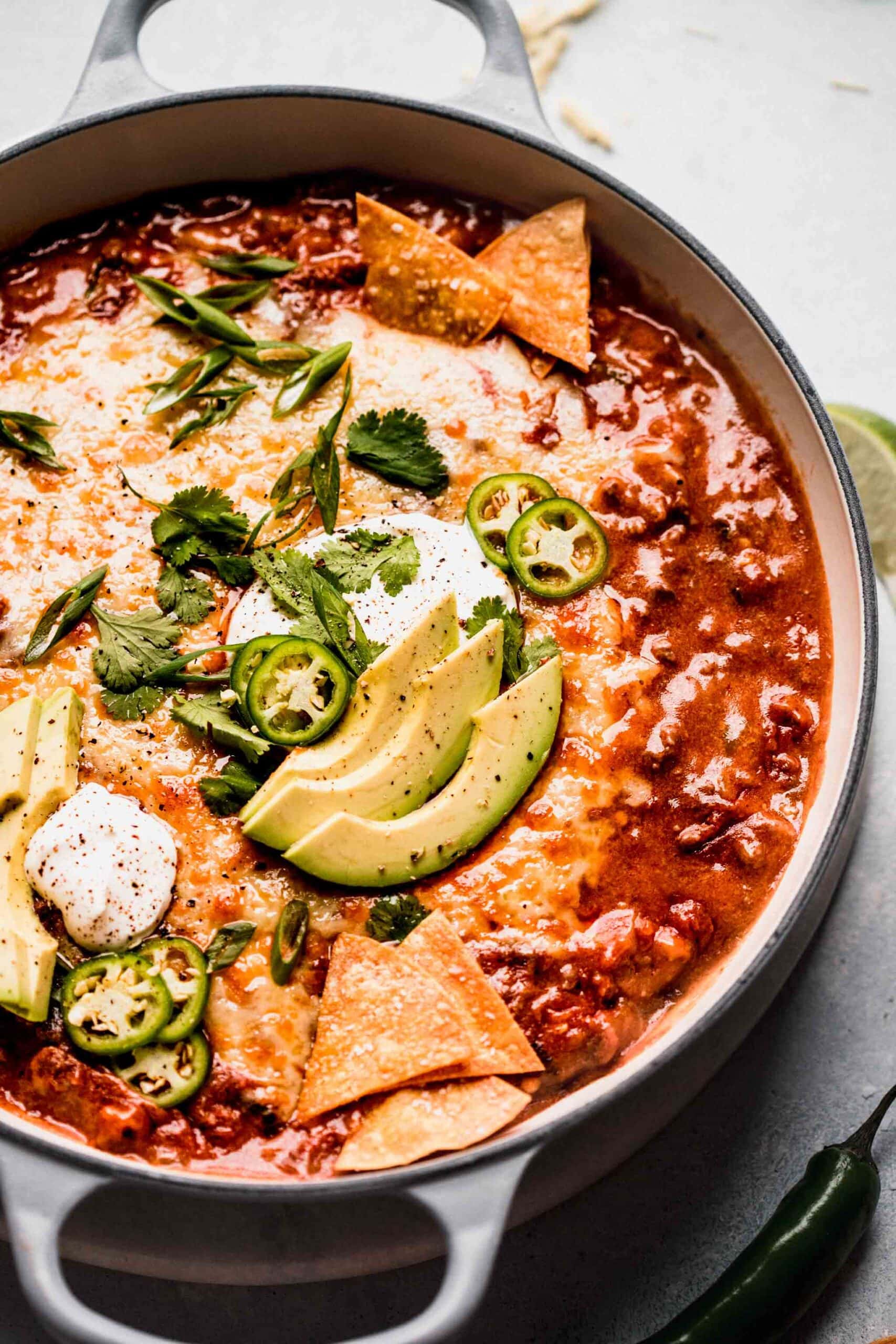 SIDE VIEW OF ENCHILADA DIP IN LARGE SKILLET.