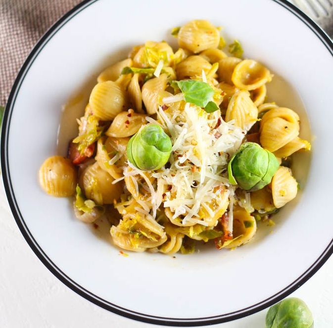 Orecchiette with Brussels Sprouts and Bacon - A quick, delicious 30 minute weeknight meal | platingsandpairings.com