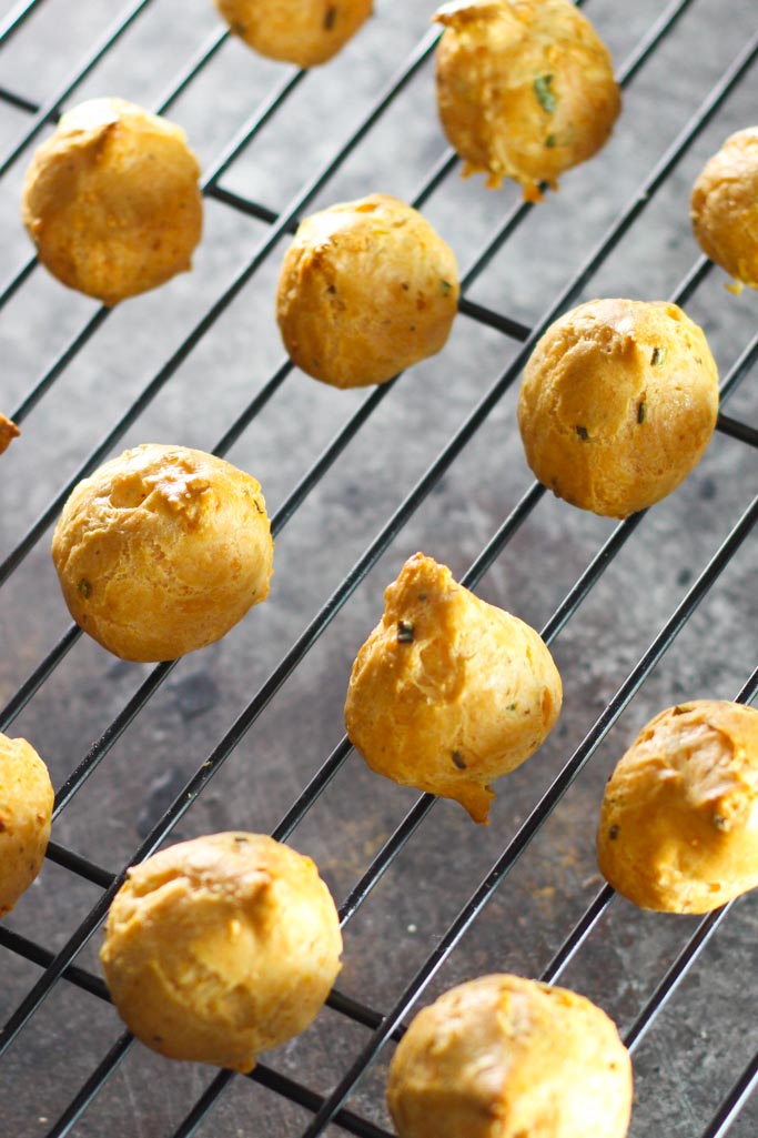 These Asiago Gougères (cheese puffs) bake up light and airy, and have a hint of buttery, sweetness from the asiago cheese.