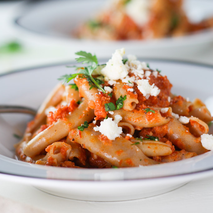 This Pasta with Chipotle Cream Sauce will change up your basic pasta routine. Smoky chipotle peppers lend a bit of heat while the cotija cheese makes it incredibly creamy and delicious. It's a perfect #MeatlessMonday option! | platingsandpairings.com
