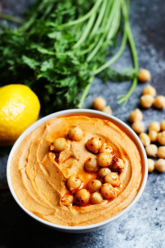 This Harissa Hummus is smoky, spicy and tangy. A perfect party dip! | platingsandpairings.com