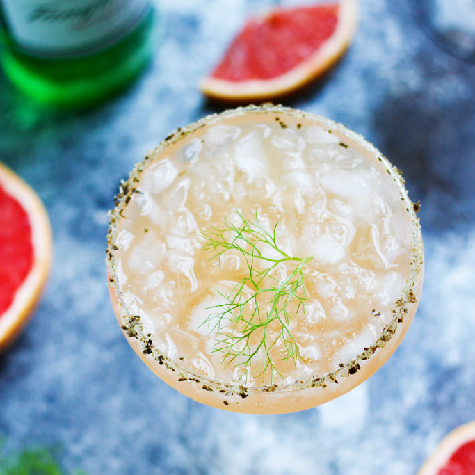 Fresh Grapefruit Juice and a Fennel Simple Syrup combine with a Rosemary Salted Rim in this Salty Dog Variation | platingsandpairings.com