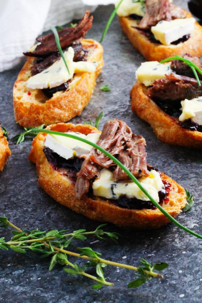 These Short Rib Crostini with Cambozola Cheese and Cherry Jam make a perfect appetizer that's as suitable for elegant entertaining as it is for football tailgating | platingsandpairings.com