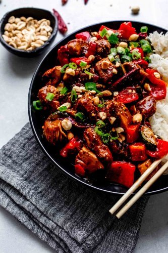 Side view of plate of kung pao chicken.