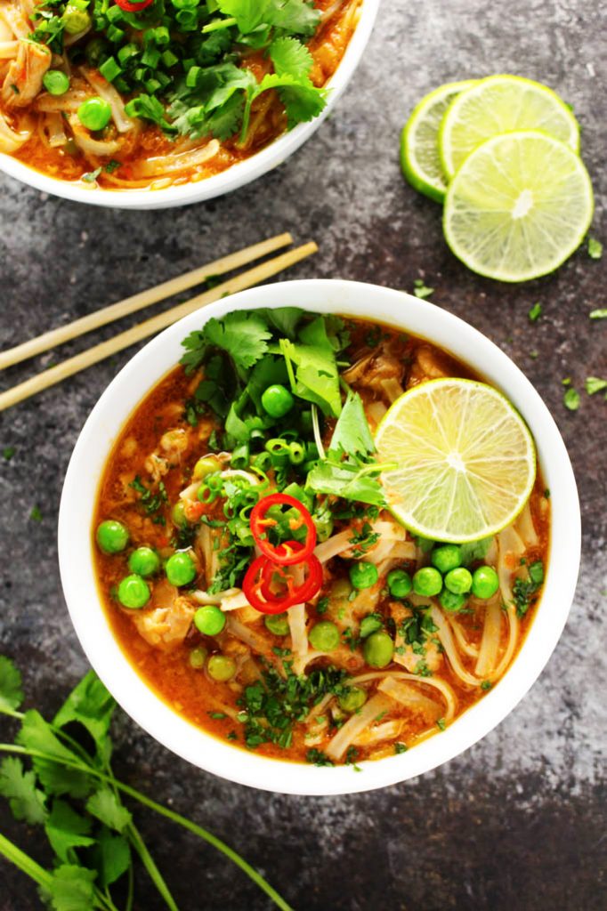 This Easy Slow Cooker Thai Chicken Noodle Soup makes it easy to enjoy your favorite spicy, aromatic, authentic Thai soup at home! | platingsandpairings.com