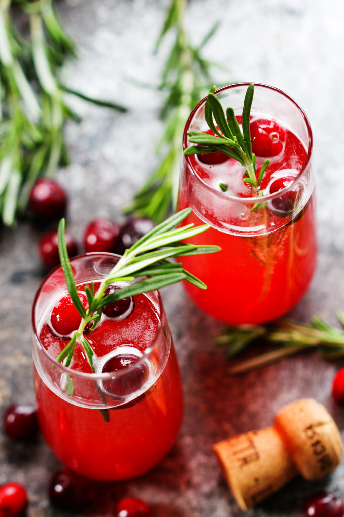 This Cranberry Ginger Bellini is a festive sparkling cocktail that's perfect for brunch or holiday parties. | platingsandpairings.com