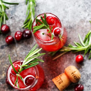 This Cranberry Ginger Bellini is a festive sparkling cocktail that's perfect for brunch or holiday parties. | platingsandpairings.com