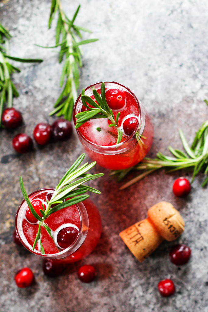 This Cranberry Ginger Bellini is a festive sparkling cocktail that's perfect for brunch or holiday parties. | platingsandpairings.com